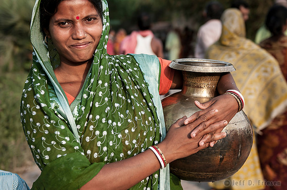 Woman Smiles after Collecting Water 2