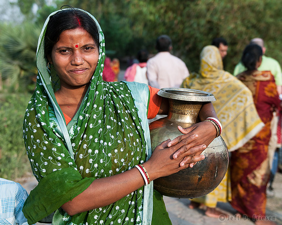 Woman with full water container.