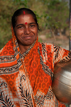 Woman Smiles after Collecting Water