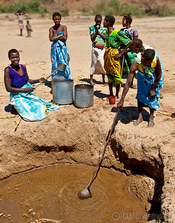 Women at Riverbed Scoop Hole