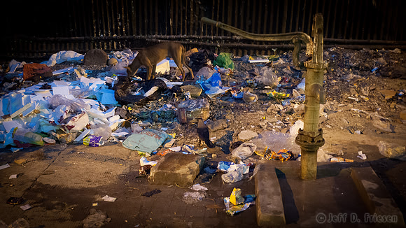Hand Pump and Sidewalk Trash