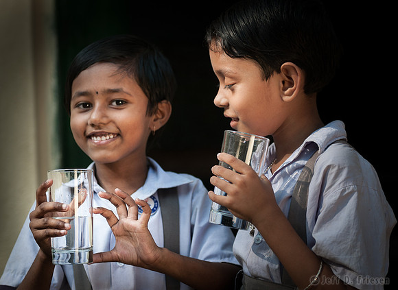 Two girls with water glasses